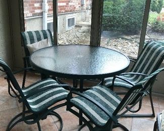 7 piece patio set glass top round dining table, 2 swivel chairs, 2 stationary chairs, glass top end table and floor lamp