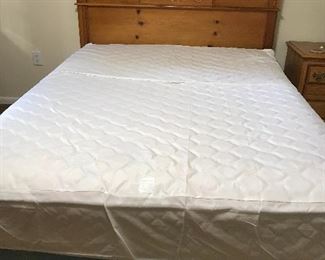 Queen size bed with mattress, box springs, headboard and frame.