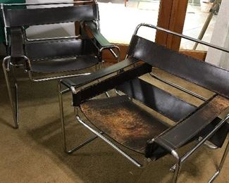 MCM Wasilly leather and chrome chairs. Sleek MCM look. Leather sling comfort.