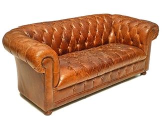 Vintage three-seat sofa, having brown leather upholstery in the Chippendale style
