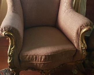 A pair of victorian style arm chairs