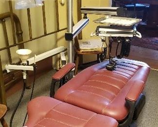 Dental chair with tray and tools and light