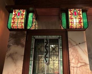Upper stain glass on the back bar