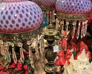 Cranberry lamp with lusters (2 globes--- middle one is a reflection)