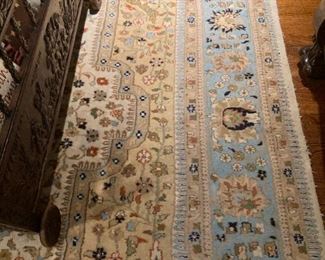 Large rug with tans and pale blue