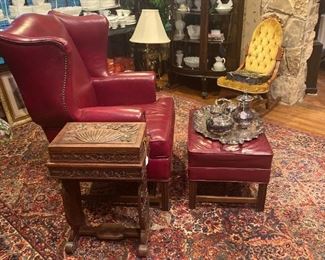 Red leather wingback chair and ottoman
