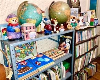 Vintage world globes, ceramic bank and other figures, vintage kids books, vintage Fisher Price and Playskool wooden and paper puzzles 