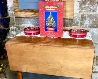Antique pine drop leaf table w/ chairs, 2 packs of Coke plates, Christopher Radko ceramic Christmas tree, wooden Santa basket
