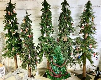 Tall thin Christmas trees w/ decorations