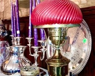 Brass lamp w/ red cased glass globe, cobalt & silverplate drum bank, silverplate items