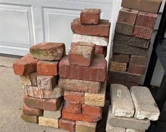 Approximately 60 used bricks