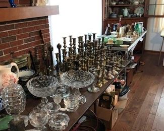 Many antique brass candlesticks and other glass and china antiques