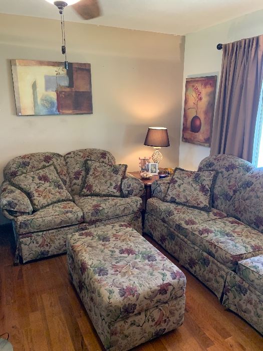 Floral sofa sleeper, loveseat and ottoman.