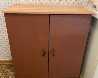 Copper colored metal two door cabinet