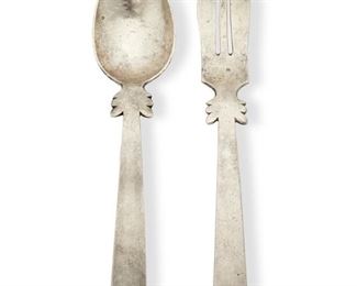 69
A William Spratling Sterling Silver Salad Serving Set
Circa 1944-1946, First Design Period; Taxco, Mexico
Marked for William Spratling; Further marked: Sterling
Comprising a serving spoon (9.5") and fork (9.625") with feathered motif to handles, 2 pieces
7.23 oz. troy approximately
Estimate: $300 - $500
