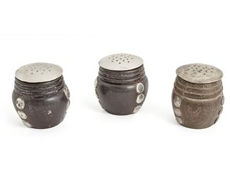 70
A Group Of William Spratling Silver Salt And Pepper Shakers
Circa 1964-1967, Third Design Period; Taxco, Mexico
Each stamped for William Spratling
Each silver shaker top over a carved barrel-form ebony body with applied silver disks, 3 pieces
2.25" H x 2" Dia.
8.1 gross oz. troy approximately
Estimate: $400 - $600