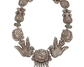 75
A Matl Silver And Turquoise Necklace
Circa 1935-1948; Mexico City, Mexico
Stamped twice: Matl and Matl to applied plaque
Designed by Matilde Poulat, the repousse rose and dove-motif necklace accented with turquoise-set eyes and seven silver drops
19" L x 2.75" H
113.9 grams
Estimate: $2,500 - $3,500