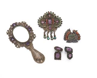 83
A Group Of Matl And Mexican Jewelry Items
Mid-20th Century
Four groupings

A Matl brooch
Stamped: Matl / 925 / Mexico / 142093
Suspending fringe set with amethyst, coral, and turquoise
3" L x 2.25" W

A Matl turkey brooch
Stamped: Matl / 925 / Mexico
Set with coral and turquoise
1.25" L x 1.50" W

A Matl mirror
Stamped: Matl / 925 / Mexico / MS 12
Set with amethyst and turquoise
4.50" L x 2.10" W

A pair of amethyst cufflinks
Unmarked
2 pieces
1.25" L x 1.50" W
5 pieces total
58 grams gross
Estimate: $500 - $700