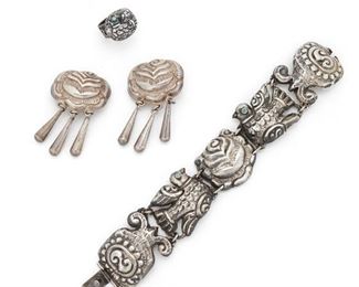 86
A Group Of Matl Sterling Silver Jewelry
Circa 1935-1948; Mexico City, Mexico
Stamped: Matl on a plaque / M REGIS / 14 - 2093 / Mexico / 925 / MS - 12
Comprising a repousse bracelet with rose and bird motif with turquoise eyes (7" L x 1.25" W), a similar pair of clip-back rose earrings suspending silver drops (2.25" L x 1.25" W), and a ring topped with a repousse bird with turquoise eye (ring size: 7.75), 4 pieces
81 grams
Estimate: $700 - $900