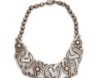 90
A William Spratling Silver Necklace
Circa 1940-1946, First Design Period; Taxco, Mexico
Stamped for William Spratling; Further stamped: Made in Mexico / Silver
With a Pre-Columbian inspired intertwined "X-O" design
12" L x 1.25" H
121 grams
Estimate: $1,500 - $2,000