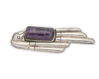 105
A William Spratling "Lorenzo" Sterling Silver And Amethyst Brooch
Circa 1940-1946, First Design Period; Taxco; Mexico
Stamped for William Spratling; Further stamped: Made in Mexico / Sterling
A stylized parrot profile set with a large cabochon amethyst
4.75" H x 1.25" W
62 grams
Estimate: $800 - $1,200