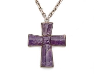 106
A William Spratling Silver And Amethyst Pendant Necklace
Circa 1940-1944, First Design Period; Taxco Mexico
Pendant stamped for William Spratling; Further stamped: Made in Mexico / Spratling Silver
The cross set with five carved amethyst suspended from a chain, 2 pieces
Chain: 2" L; Pendant: 3" H x 2.5" W
118 grams
Estimate: $800 - $1,200