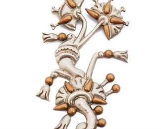 108
A William Spratling "Tree Of Life" Silver And Copper Brooch
Circa 1940-1946, First Design Period; Taxco, Mexico
Stamped for William Spratling; Further stamped Made in Mexico / Silver
Designed as a polished silver abstract foliate motif topped with copper elements
4.25" L x 2" W
55 grams
Estimate: $1,200 - $1,800