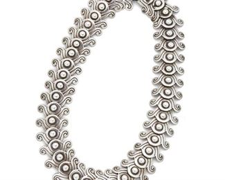 114
A Los Castillo Silver Necklace
1940; Taxco, Mexico
Stamped: Los Castillo / Sterling / Made in Mexico / Sterling / 262
Designed with stylized swirl links, ball joints, and hook and eye closure
17" L x 1" H
180 grams
Estimate: $600 - $900