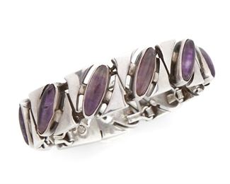 137
An Antonio Pineda Sterling Silver And Amethyst Bracelet
Circa 1953-1979; Taxco, Mexico
Crown mark for Antonio Pineda; Further stamped: Eagle 17 / Silver / 970 / Hecho en Mexico
The tapered bracelet of stylized silver arrow motif links alternating with elongated oval cabochon amethysts links
6.75" L x .55"-.75" W
74 grams
Estimate: $600 - $800
