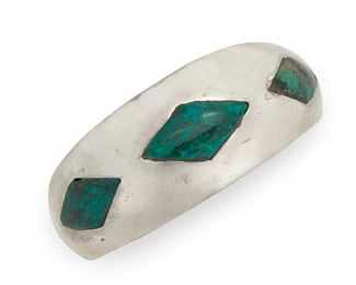 153
An Antonio Pineda Sterling Silver And Azurmalachite Cuff Bracelet
Circa 1953-1979; Taxco, Mexico
Crown mark for Antonio Pineda; Further stamped: Eagle 17 / Hecho en Mexico / 970
The tapered rigid cuff featuring diamond shape inlay of azurmalachite
6.75" C x .5"-1.1" W, wrist opening: 1.5"
49.5 grams
Estimate: $500 - $700