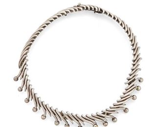167
An Antonio Pineda Sterling Silver Necklace
Circa 1953-1979; Taxco, Mexico
Crown mark for Antonio Pineda; Further stamped: Eagle 17 / Silver / 970 / Sterling / Mexico
The hinged, rigid collar comprising diagonal silver strips tipped with spheres
16" L x 1" H
136 grams
Estimate: $800 - $1,200