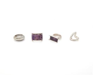 171
Four Antonio Pineda Sterling Silver Rings
Circa 1953-1979; Taxco, Mexico
Crown mark for Antonio Pineda; Further stamped: Eagle 3 / Eagle 17 / Hecho en Mexico / 970 / JVL Taxco / Silver / 925
Comprising a ring topped with four elongated cabochon amethyst tablets (ring size: 9.25), a ring topped with a rectangular-cut amethyst (ring size: 7.5), a polished dome ridge ring (ring size: 8.75), and a zig-zag ring (ring size 6), 4 pieces
57.5 grams
Estimate: $500 - $700