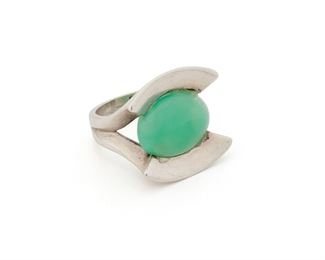 172
An Antonio Pineda Sterling Silver And Chrysoprase Ring
Post-1953; Taxco, Mexico
Crown mark for Antonio Pineda; Further stamped: 925 / [illegible markings]
The modernist ring features an oval cabochon chrysoprase
Ring size: 5.75
10 grams
Estimate: $300 - $500