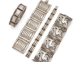 194
A Group Of Fred Davis Silver Bracelets
Pre-1948; Mexico City, Mexico
Stamped: FD [Fred Davis] / Mexico / Silver / Made in Mexico
Comprising a wide hinged bangle with a stylized deer open panel motif (7.5" L x 1.75" W), a rectangular panel bracelet with wave patterning (7.25" L x 1.25" W), a rectangular link bracelet with dot patterning (7" L x .75" W), and a domed ridged link bracelet (7" L x .5" W), 4 pieces
310 grams
Estimate: $1,000 - $2,000