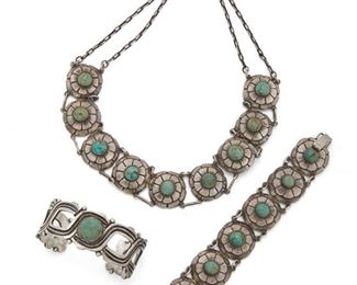 206
A Group Of Raphael Melendez Jewelry
Circa 1940; Taxco, Mexico
Stamped for Raphael Melendez; Further stamped: Taxco / 980
Comprising a floral link necklace topped with round cabochon turquoise (16" L x 1" W) en suite with a bracelet (6.5" L x 1" W) and a rigid cuff bracelet topped with a round cabochon turquoise (6.75" C x 1" W, wrist opening: 1.1"), 3 pieces
188.5 grams gross
Estimate: $600 - $800