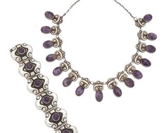 209
Two Horacio De La Parra Amethyst Jewelry Pieces
Second-quarter 20th Century; Taxco, Mexico
Stamped: Parra [Horacio de la Parra] / Mexico / 925
Comprising a necklace centering repousse links suspending oval cabochon amethysts attached by a link chain (17"L x 1.25" H) and a bracelet of curved links centering round cabochon amethysts (6.75" x 1.5"), 2 pieces
159.6 grams
Estimate: $600 - $800