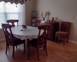 Nice solid wood table with buffet. Lots of goodies inside the buffett