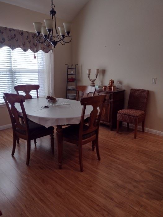 Nice solid wood table with buffet. Lots of goodies inside the buffett