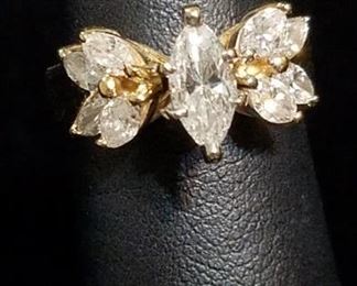 1.34  Carats of Diamonds in 14k Gold featuring a 1/2 Carat Marquise (SI2 G) Center Diamond