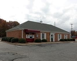 The sale will be held in this former bank building on the corner of Cox Rd and Ozark
