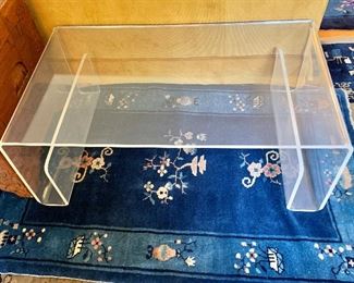 $350 Lucite Coffee Table
41" L,  24” W, 15" H.