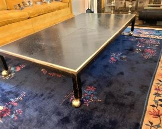 $500 Ebony stained low coffee table with brass accents on casters
11.5” H x 60” W x 34” D
