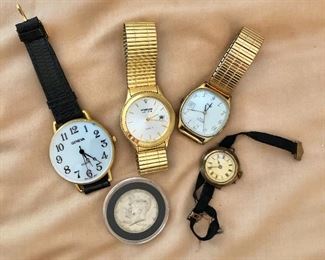 $15 each watches and Kennedy 1/2  silver dollar in case  SOLD, watch on far right SOLD 
