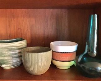 $40 each. Green glass vase, 3 pottery vases.  Left vase 5" H, 6" W, 4" D; green glass vase 9.75" H.  Two center vases SOLD 