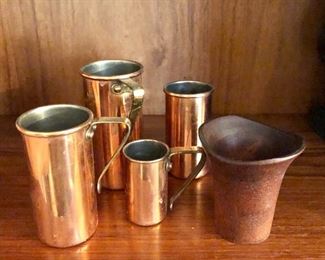 $40 set of 4 copper measuring cups.  4" H to 2.75" H.  $XX carved wood vase 3" H, 2.75" W.  