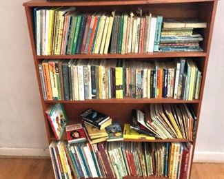 Collection of children's books.  Bookcase $75 