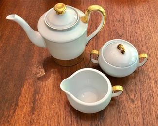 $60 Coffeepot and sugar bowl and creamer.   Coffeepot: 6.5" H, 8.75" W.   Sugar bowl: 4" diam, 3.75" H.  Creamer: 4.25" diam, 2.75" H. 