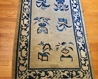 $95  Blue and cream carpet with floral design and border 