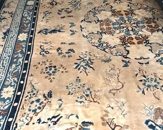 $1250 Large area rug with floral motif.  Approx 165" L x 144" W.  