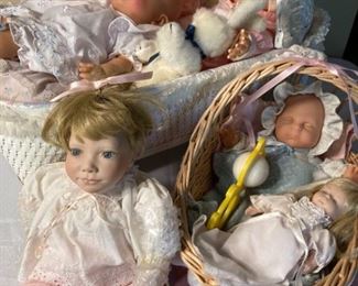 Collection of Sleeping Baby Dolls and Cradles